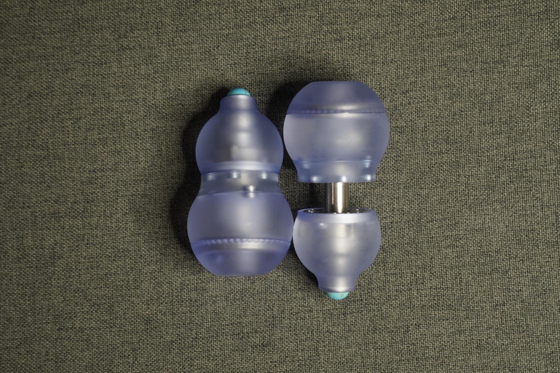 A sleek purple gourd-shaped fidget toy featuring a 4-in-1 design: magnetic push card, fidget spinner, ratchet gear, and popping coin. Highlighting its durable PMMA material, ergonomic grip, and premium quality, perfect for stress relief and focus.