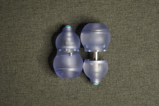 A sleek purple gourd-shaped fidget toy featuring a 4-in-1 design: magnetic push card, fidget spinner, ratchet gear, and popping coin. Highlighting its durable PMMA material, ergonomic grip, and premium quality, perfect for stress relief and focus.