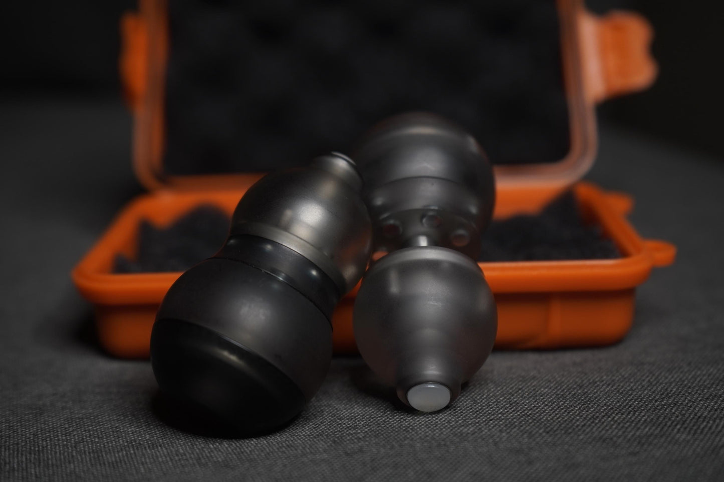 A sleek black gourd-shaped fidget toy featuring a 4-in-1 design: magnetic push card, fidget spinner, ratchet gear, and popping coin. Highlighting its durable PMMA material, ergonomic grip, and premium quality, perfect for stress relief and focus.