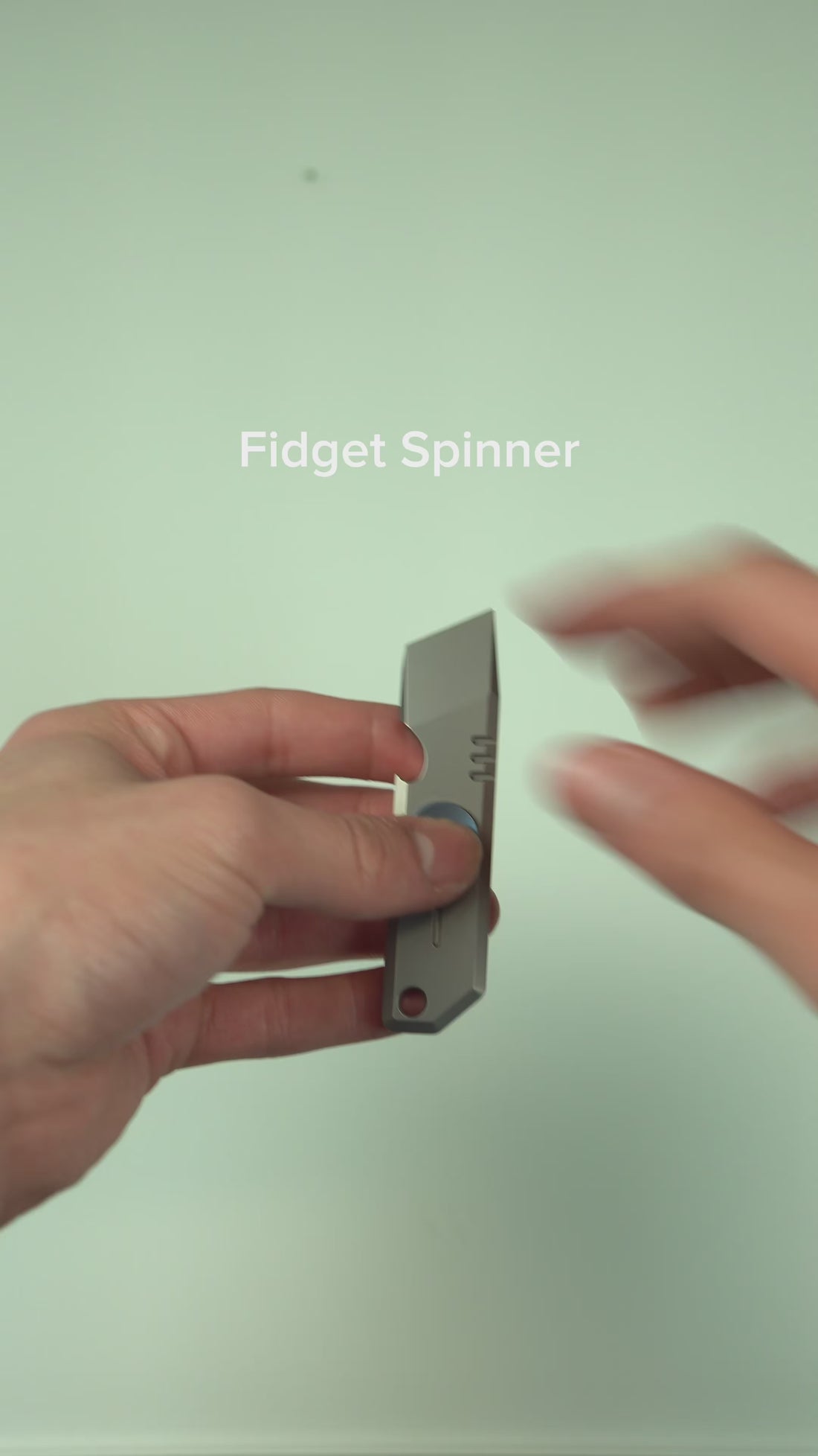 Titanium pry bar fidget demo: built-in spin and slide functions, plus the pry tip in use.