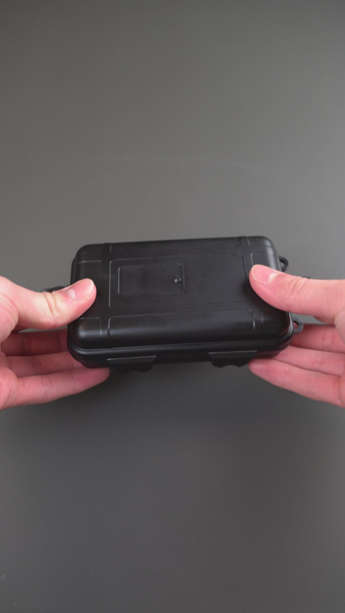 EDC storage case opened to show the foam-lined interior holding fidgets and tools.